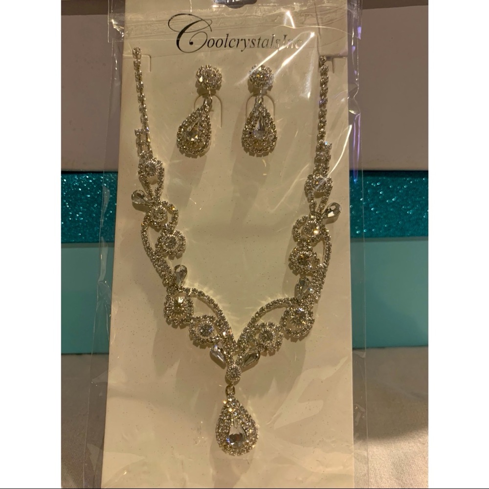 Silver teardrop earrings set with necklace; brand new never worn